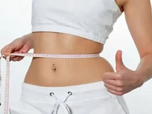 Person measuring their waist representing the weight loss program at My Doctors Clinic, Surfers Paradise, Gold Coast