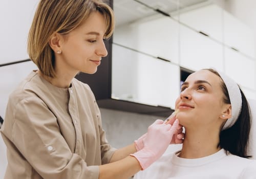 Woman seated during a consultation at a cosmetic clinic, representing doctor led cosmetic consultations at My Doctors Clinic Surfers Paradise