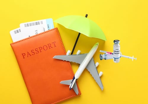 Passport, boarding pass and travel vaccine vial representing travel vaccinations at My Doctors Clinic in Surfers Paradise