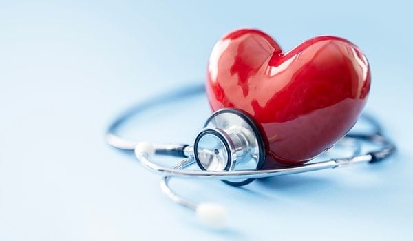 Red heart and stethoscope representing a heart health check at My Doctors Clinic Surfers Paradise